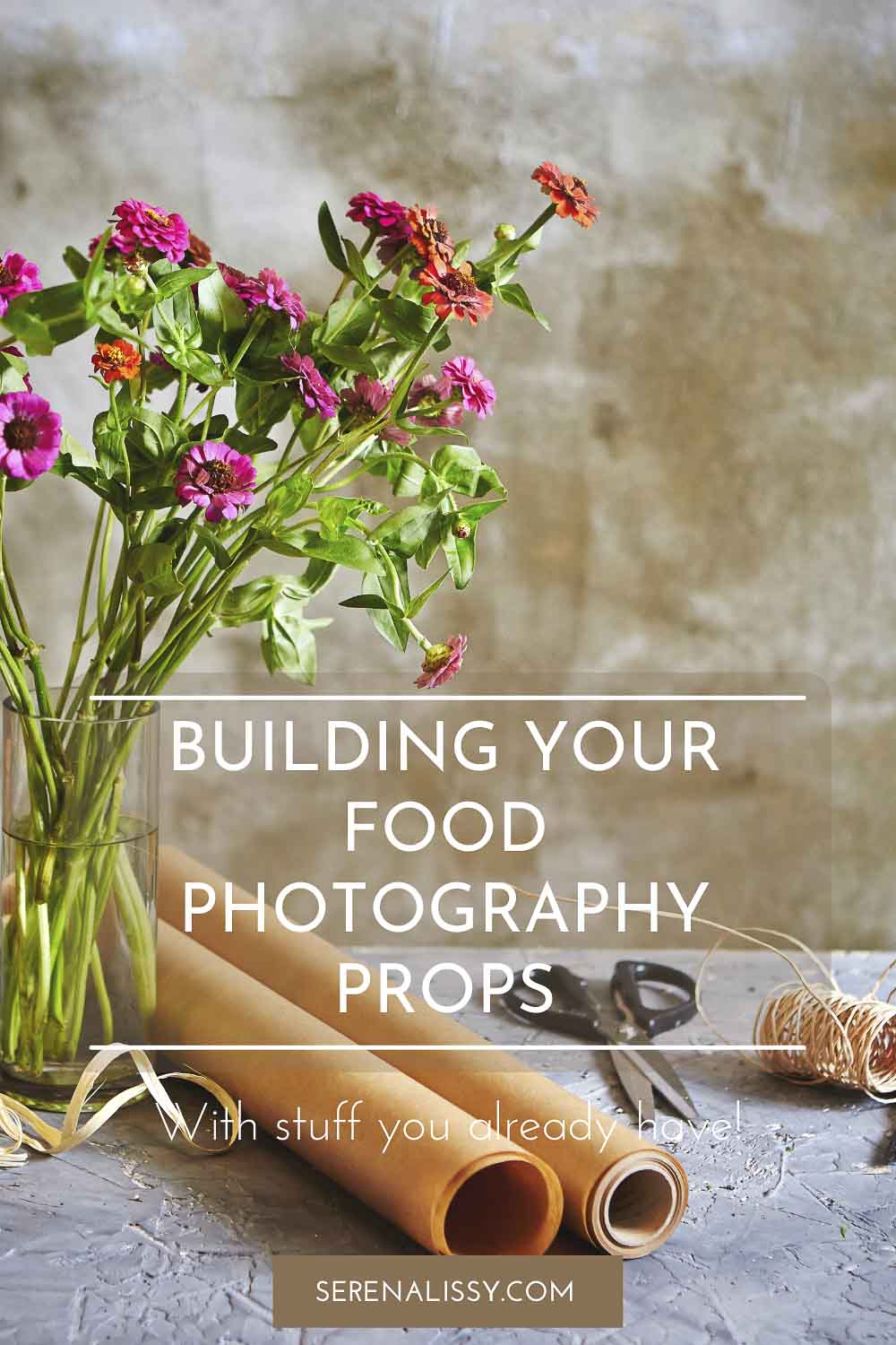 Flowers, wrapping paper, twine and scissors on table